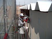 外壁工事をする上田幹事